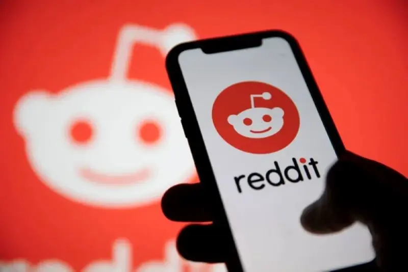 Image showing Reddit’s logo on a mobile device.